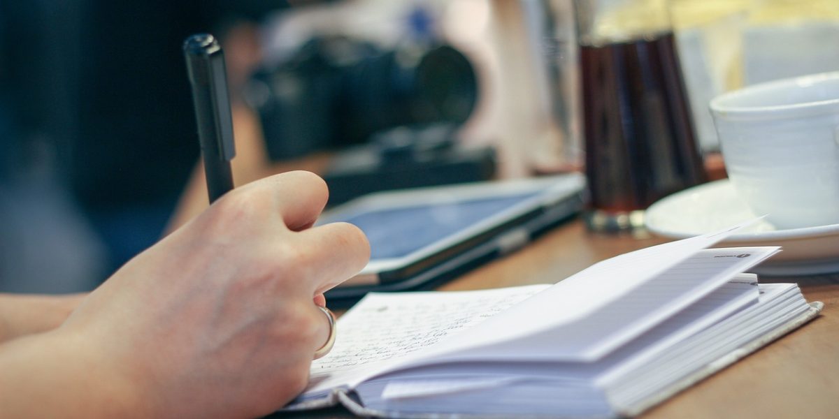 A student thoughtfully crafts their college essay, focusing on authenticity and personal storytelling.