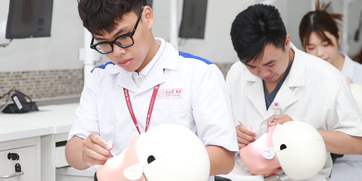 Students gain practical skills in a hands-on learning environment for a technical career.