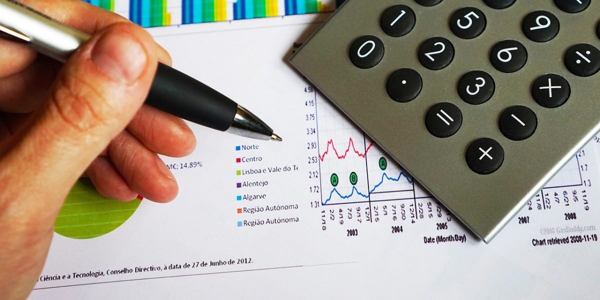 A business leader meticulously reviewing reports and data to ensure precision and accuracy in decision-making.
