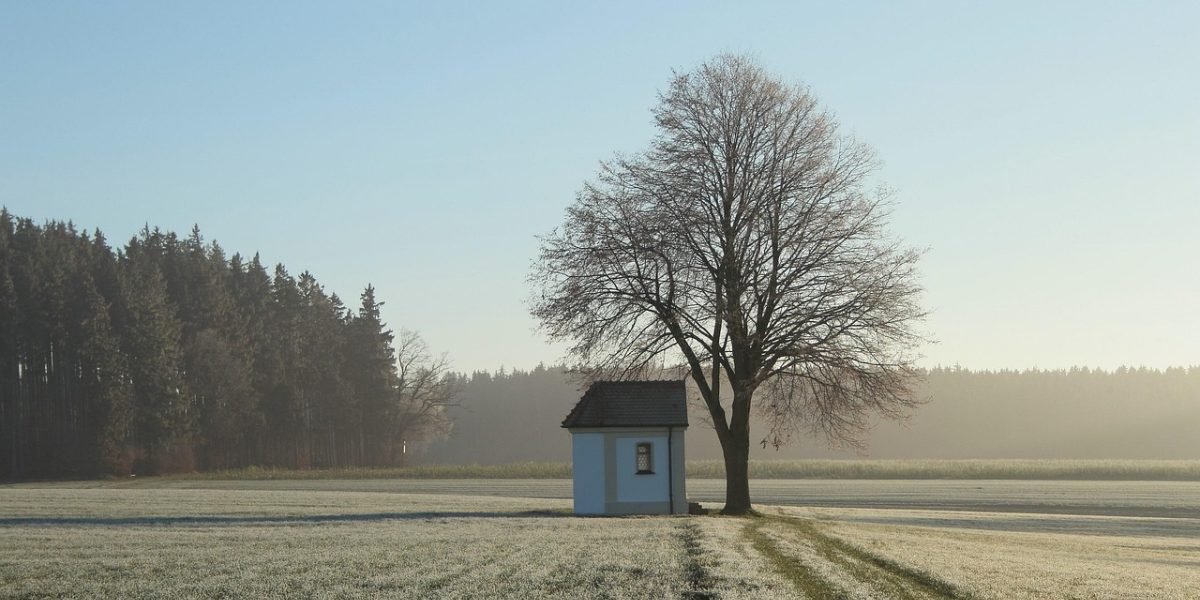 A researcher in the field observing and documenting weather conditions that could impact lidar performance.