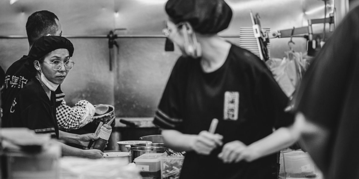 The fast-paced environment of a commercial kitchen highlights the challenges that automation seeks to address.