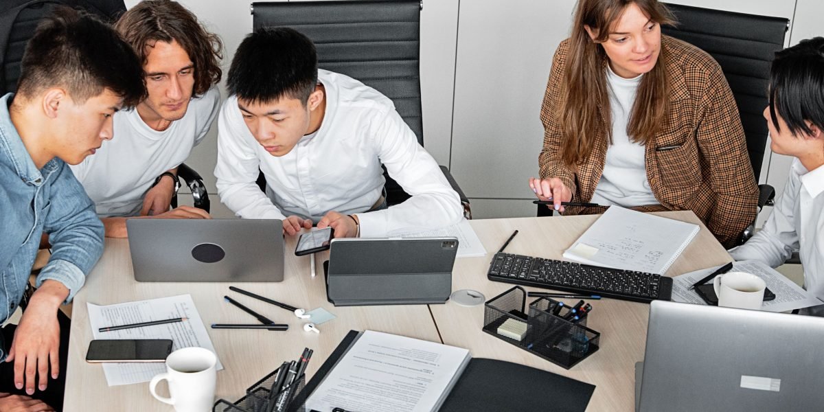 A diverse team collaborating on an innovative project, combining medical and technological expertise.